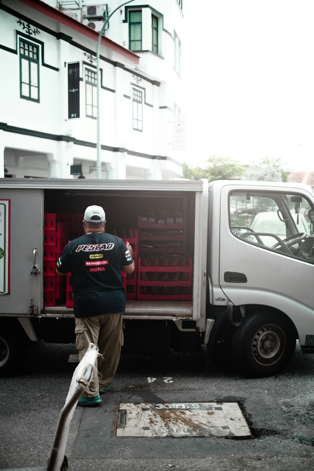 a-man-with-a-broom-and-a-truck-s6njomj32dm